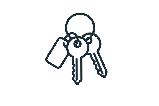 Keyring with three keys and a tag on dark background