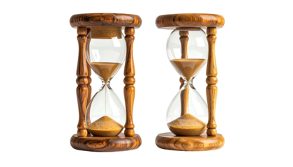 Two antique hourglasses showing the passage of time on a black background
