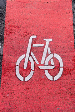 Bicycle symbol signage marking cycling lane on urban street road showing modern mobility infrastructure and safe transportation design