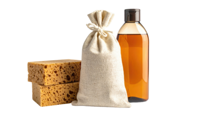 Natural cleaning supplies sponges, sack, and bottle against a black background