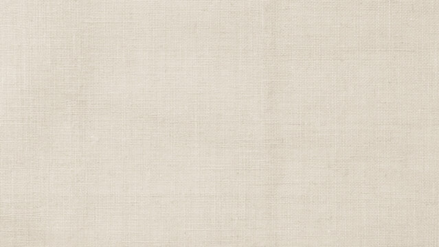 Jute hessian sackcloth woven hemp burlap fibre fabric textile texture background in sepia cream old aged brown color