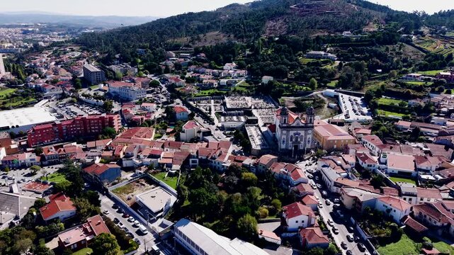 Aerial view of Valongo main church with urban buildings and hills
