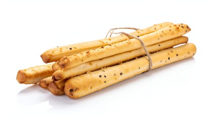 Group of baked, savory breadsticks tied with twine, close-up on white background