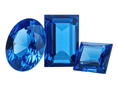 Three faceted blue gemstones on a black background, various cuts