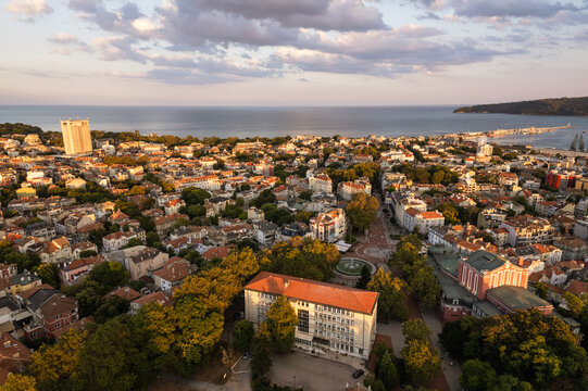 Aerial view of the city unfolds with its architectural tapestry leading to the sea, capturing the essence of urban life against the vast horizon, Varna, Bulgaria.