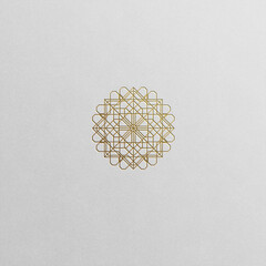 Geometric flower symbol in luxury gold shades isolated on white background.