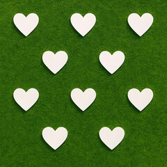 White hearts on green background