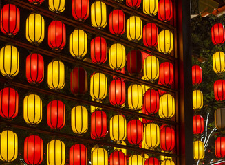 View of vibrant red and yellow lanterns glow warmly against a dark backdrop, creating a festive and inviting atmosphere, Xi'An, Shaanxi, China.