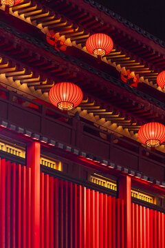 View of glowing red lanterns illuminate the intricate architecture and ancient traditions under the night sky, Xi'An, Shaanxi, China.