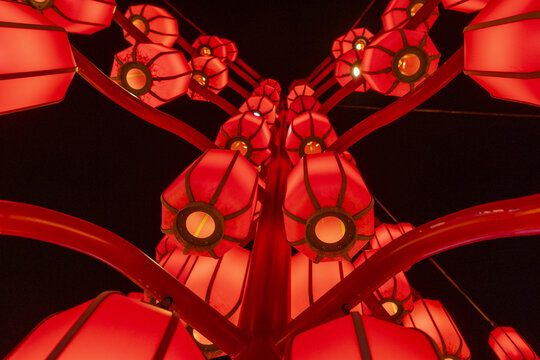 View of vibrant red lanterns illuminate the night sky with their warm glow, creating a festive and enchanting scene, Xi'An, Shaanxi, China.