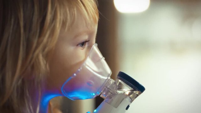 A young girl's respiratory distress is alleviated by an aerosol nebulizer, delivering medicated mist to her bronchi, easing sputum congestion, and reducing cough