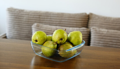 Green Pears In A Bowl On The Table In The Living Room