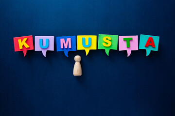 Wooden doll connecting with kumusta filipino language speech