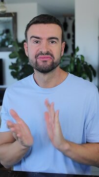 Envious man applauding with jealousy