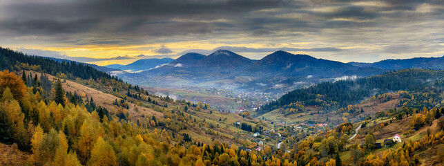 Sunny Autumn Carpathians with Puffy White During The Sunset