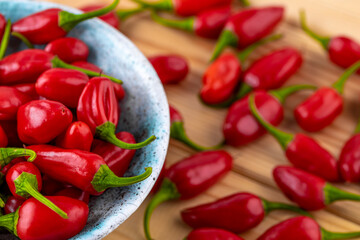 Vibrant red jalapeno pepper on a white background with space for text, ideal for food and culinary concepts.Group of ripe red jalapeno peppers .