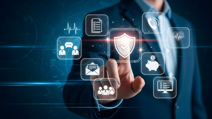 Businessman activating a virtual shield for data and service protection