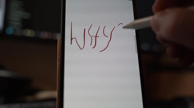 Close view of the word WHY handwritten with a stylus on a smartphone screen expressing question curiosity and critical thinking through digital note taking and modern mobile interaction indoors