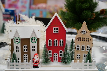 A toy house with a little Santa Claus.