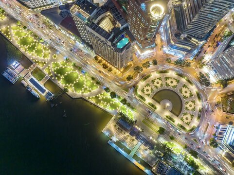 Aerial view of the illuminated Bach Dang Wharf and Me Linh Square round-about, a symphony of light reflecting off the Saigon River, Ho Chi Minh City, Ho Chi Minh City, Vietnam.