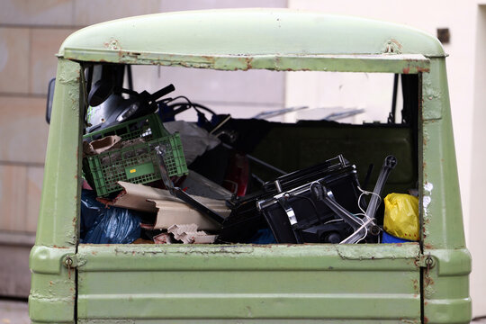 Old Green Utility Vehicle Loaded with Items