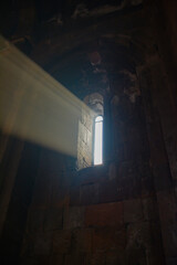 Monastery interior. An old lamp in the church. Sunlight streaming through the windows. Christianity and religion.