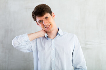 Man experiencing acute pain in his neck