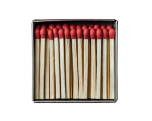 Close-up overhead shot of a box filled with unlit wooden matches, red heads