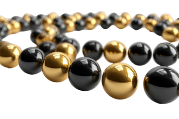 Close-up of glossy gold and black spheres arranged in a spiral against a black background