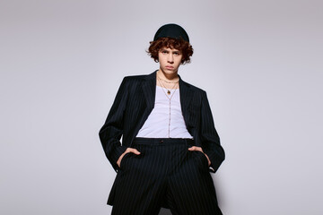 Stylish young man exudes confidence in a sleek black outfit with modern flair