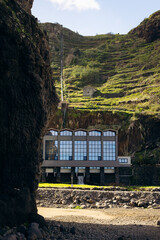 Madeira, Portugal - November 11, 2025: hydroelectric power station in Madeira. Hydroelectric power station nestled in lush green hills with copy space