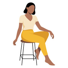 A person sitting on a stool, wearing a v-neck shirt and yellow pants, with their arms resting.