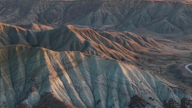 Aerial view of the rugged Calanchi del Cannizzola landscape, showing the stark beauty and geological formations, Calanchi del Cannizzola, Sicilia, Italy.