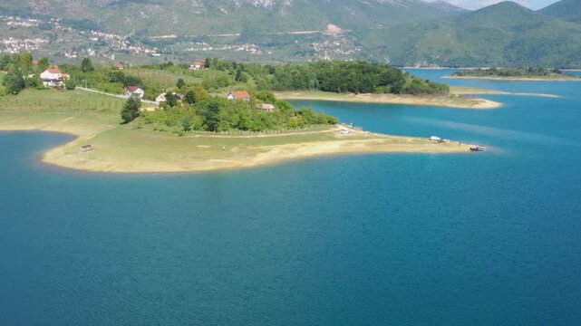 Lake peninsula with blue water and rural landscape in Bosnia and Herzegovina