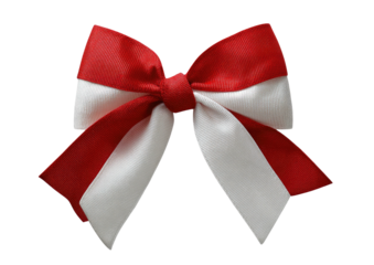 A vibrant, two-tone ribbon bow, featuring red and white stripes, isolated on black