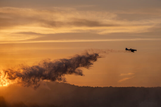 Light aircraft dropping water onto a wildfire in Ourense, Spain