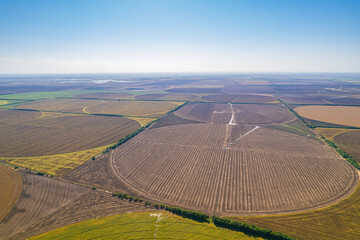 Aerial view of circular crop field with irrigation system