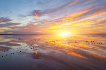 Vibrant sunset reflection over calm salt lake