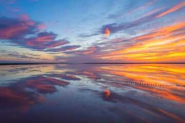 Vivid sunset over reflective salt lake