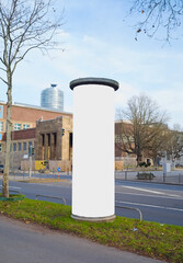 Empty advertising pillar, blank ad space,outdoor setting, free copy space