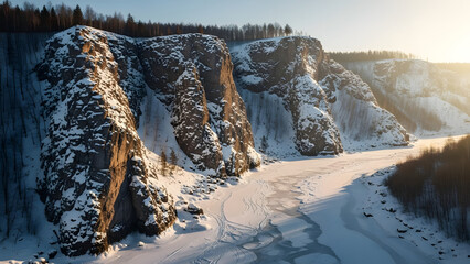 dramatic sunlit cliffs covered in snow alongside frozen river during winter sunset casting warm golden light on rugged rock faces and icy water surface creating stark contrast