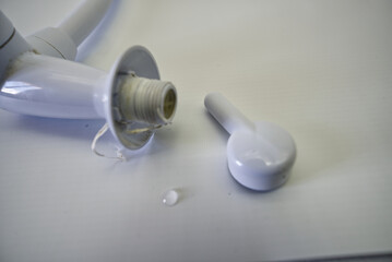 Disassembled white kitchen faucet