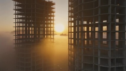 Ethereal sunrise over towering skeletal skyscrapers piercing through a dense morning fog, highlighting the ongoing construction of a modern city skyline at dawn with golden light.