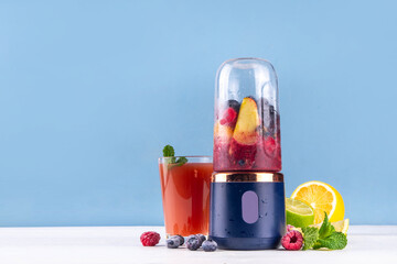 Healthy fruit and berry smoothie drink in portable blender