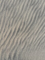 Obraz premium Sand pattern as background. Sand close-up surface for nature. Fine sand texture background for outdoor, eco and minimalist projects