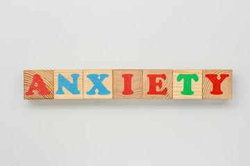 Anxiety formed with childrens wooden alphabet blocks