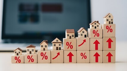 Wooden blocks stacked in ascending order with houses and percentage signs real estate housing