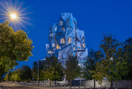 Arles, Provence, France &ndash; 13.10.2025: Illuminated Luma tower in Workshop park, Arles at blue hour. 