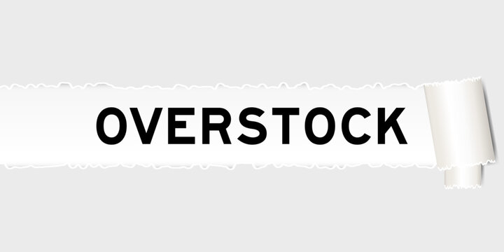 Ripped gray paper background that have word overstock under torn part