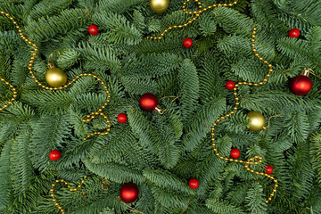 Evergreen Fir Branches with Red Berries, Golden Garland and Christmas Ornaments Flat Lay Background